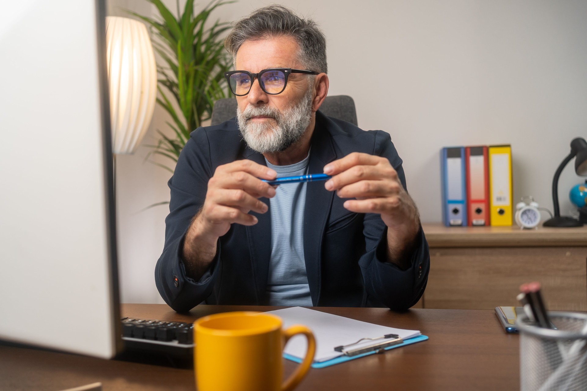 Portrait of creative mature man working on sketch